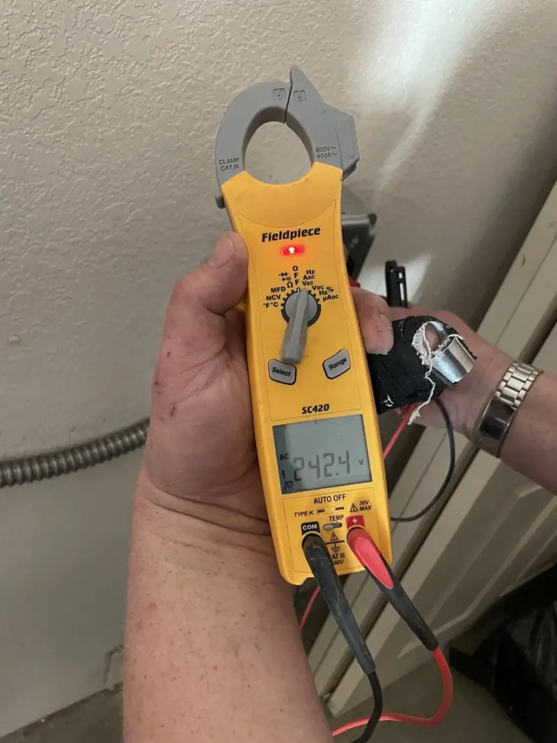 Voltage testing with clamp meter during Ceiling Fan Installation in Alice